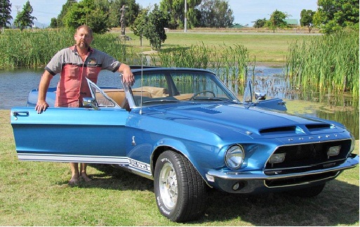 Here is Mark, the restorer, with the finished car. It's back to the original colors.